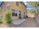 Backyard featuring a small concrete patio, rock landscaping, and a privacy wall at 5324 Pendergrass St, North Las Vegas, NV 89081