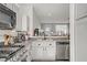 Kitchen with tile floor, black sink faucet, gray countertop, and stainless steel appliances at 5324 Pendergrass St, North Las Vegas, NV 89081