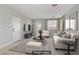 Bright, staged living room with tile flooring, neutral decor, and ample natural light at 5324 Pendergrass St, North Las Vegas, NV 89081
