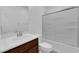 Bathroom featuring modern vanity, shower/tub combo, and a toilet at 5677 Asyma Ct, Las Vegas, NV 89113