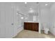 A full bathroom with dual sinks, cherry cabinets, and a shower/tub combo at 5677 Asyma Ct, Las Vegas, NV 89113