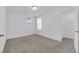 A simple bedroom offers carpeted floors and a large closet with wire racks at 5677 Asyma Ct, Las Vegas, NV 89113