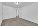 A cozy bedroom features neutral carpet, a closet, and a bright interior door at 5677 Asyma Ct, Las Vegas, NV 89113