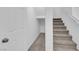 Clean hallway with carpeted stairs and white walls at 5677 Asyma Ct, Las Vegas, NV 89113