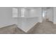 The carpeted loft landing offers neutral paint and lots of natural light at 5677 Asyma Ct, Las Vegas, NV 89113