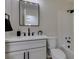 Modern bathroom with a sleek vanity, black hardware, and shower at 5742 Forsythe Dr, Las Vegas, NV 89142