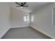 This spacious bedroom has carpet, neutral paint, a ceiling fan and plenty of natural light at 5742 Forsythe Dr, Las Vegas, NV 89142