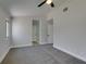 Cozy carpeted bedroom with ceiling fan and multiple closets at 5742 Forsythe Dr, Las Vegas, NV 89142