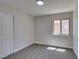 This cozy bedroom features neutral walls, plush carpet, and a closet at 5742 Forsythe Dr, Las Vegas, NV 89142
