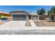 Charming single-story home with a well-maintained front yard, a two-car garage, and a neutral-toned exterior at 5742 Forsythe Dr, Las Vegas, NV 89142
