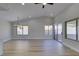Airy living room featuring wood-look floors, recessed lighting, slider door and access to kitchen at 5742 Forsythe Dr, Las Vegas, NV 89142