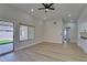 Open living space with wood-look floors, recessed lighting, and seamless transition to the outdoor area at 5742 Forsythe Dr, Las Vegas, NV 89142