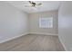 Comfortable bedroom with window, neutral paint, and hardwood floors throughout at 5751 E Hacienda Ave # 159, Las Vegas, NV 89122
