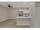 Open concept kitchen with stainless steel refrigerator, a breakfast bar and fresh paint at 5751 E Hacienda Ave # 159, Las Vegas, NV 89122