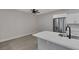 Open concept kitchen with stainless steel refrigerator, a breakfast bar and fresh paint at 5751 E Hacienda Ave # 159, Las Vegas, NV 89122