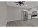 Bright kitchen featuring stainless steel appliances, white cabinetry, and hardwood flooring at 5751 E Hacienda Ave # 159, Las Vegas, NV 89122