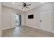 Cozy living room featuring a sliding door, a ceiling fan, and neutral colored walls at 5751 E Hacienda Ave # 159, Las Vegas, NV 89122