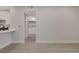 Open concept living room with fresh paint, modern flooring, and laundry access at 5751 E Hacienda Ave # 159, Las Vegas, NV 89122