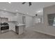 Open concept living room and kitchen with fresh paint and modern appliances at 5751 E Hacienda Ave # 159, Las Vegas, NV 89122