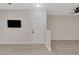 Open concept living room with fresh paint, modern flooring and a television at 5751 E Hacienda Ave # 159, Las Vegas, NV 89122