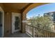 Balcony showcasing white railings, and an exterior view of foliage and a nearby building at 5855 Valley Dr # 2092, North Las Vegas, NV 89031