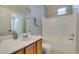 Neat and clean full bathroom with a single vanity sink, toilet, framed mirror, and tub shower at 5855 Valley Dr # 2092, North Las Vegas, NV 89031