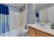 Well-lit bathroom featuring a shower-tub combo and single sink vanity at 5855 Valley Dr # 2092, North Las Vegas, NV 89031