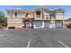 An exterior view of the apartment building with parking and a well-maintained facade at 5855 Valley Dr # 2092, North Las Vegas, NV 89031
