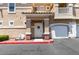Inviting front entrance with a welcoming welcome sign, covered porch, and white front door at 5855 Valley Dr # 2092, North Las Vegas, NV 89031