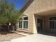 Home exterior featuring a covered patio and well-maintained landscaping at 6245 Hawthorn Woods Ave, Las Vegas, NV 89130