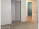 Bedroom featuring closet, neutral carpet and view of the hallway at 6245 Hawthorn Woods Ave, Las Vegas, NV 89130