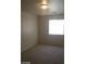 Carpeted bedroom showcasing a window with natural light at 6245 Hawthorn Woods Ave, Las Vegas, NV 89130
