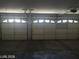 Spacious three car garage with ample room for vehicles and storage at 6245 Hawthorn Woods Ave, Las Vegas, NV 89130
