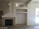 Living room featuring fireplace, built in shelving, and exterior access at 6245 Hawthorn Woods Ave, Las Vegas, NV 89130