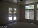 Bright living room with double doors to the backyard and large windows at 6245 Hawthorn Woods Ave, Las Vegas, NV 89130