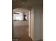 Open-concept living space with tile floors flowing into the kitchen area at 6245 Hawthorn Woods Ave, Las Vegas, NV 89130