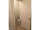 Small half bathroom featuring toilet, tile floor, and sink at 6245 Hawthorn Woods Ave, Las Vegas, NV 89130