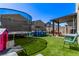 Well kept backyard features a trampoline, above ground pool, and shaded pergola at 6313 Voss St, North Las Vegas, NV 89081