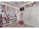 ' bedroom with storage, a small desk, personal decor, and closet space at 6313 Voss St, North Las Vegas, NV 89081