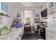 Cozy bedroom with a bed, shelving, and decorative artwork, providing a comfortable and inviting space at 6313 Voss St, North Las Vegas, NV 89081