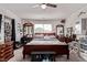 Bright bedroom boasts a ceiling fan and multiple mirrors, creating an open feel at 6313 Voss St, North Las Vegas, NV 89081
