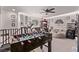 Bright bonus room featuring a foosball table, lounge seating, and ample space for activities at 6313 Voss St, North Las Vegas, NV 89081