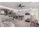 Spacious bonus room featuring a TV, foosball table, treadmill, and comfortable seating area at 6313 Voss St, North Las Vegas, NV 89081