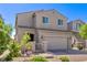 Attractive two-story home with a neutral exterior, a brick driveway, and a welcoming front entrance at 6313 Voss St, North Las Vegas, NV 89081