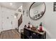 Inviting foyer with stylish decor, wood-look flooring, and a staircase leading to the upper level at 6313 Voss St, North Las Vegas, NV 89081