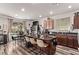 Modern kitchen with an island, plenty of counter space, and an open dining and living area at 6313 Voss St, North Las Vegas, NV 89081