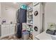 Laundry room with stacked washer and dryer, plus plenty of storage space at 6313 Voss St, North Las Vegas, NV 89081