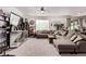Bright living room boasts a large sectional sofa, a ceiling fan, and an entertainment area at 6313 Voss St, North Las Vegas, NV 89081