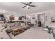 Spacious living room features a large sectional sofa, with view to kitchen area at 6313 Voss St, North Las Vegas, NV 89081