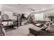 Cozy living room with comfortable seating, a ceiling fan, and ample natural light, perfect for relaxation at 6313 Voss St, North Las Vegas, NV 89081